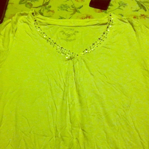 This nice but used short sleeve shirt with gems