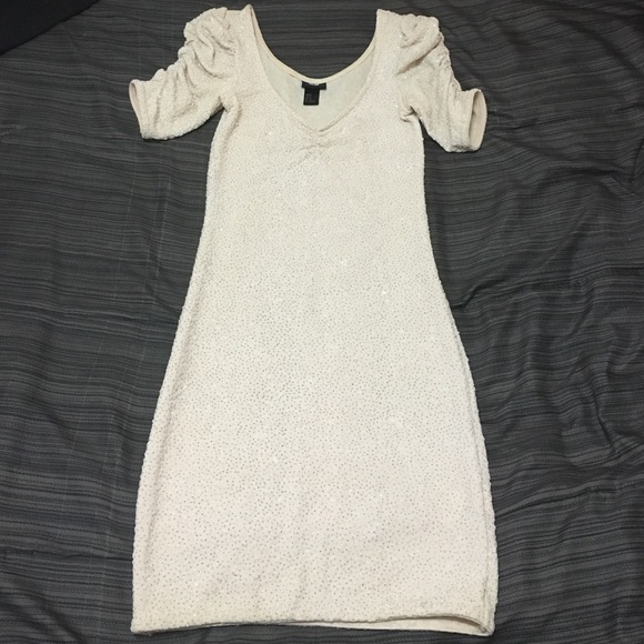 Silver glitter covered light cream colored dress