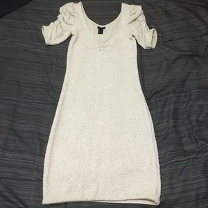 Silver glitter covered light cream colored dress