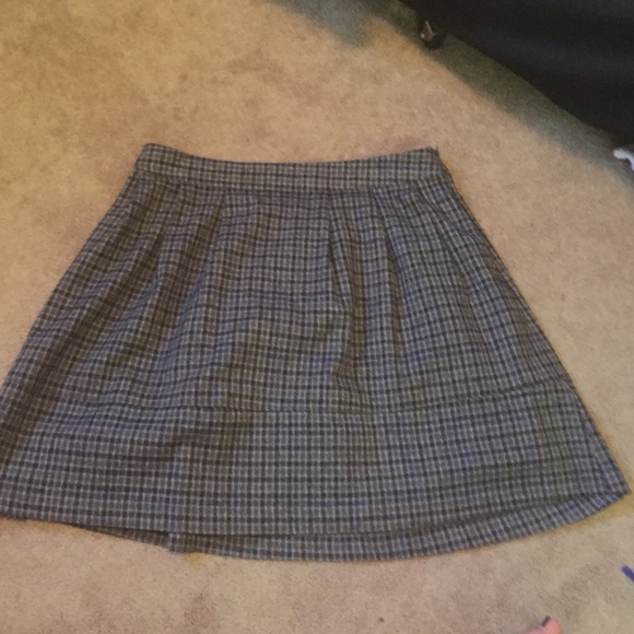 Plaid midi skirt closes with zipper on side