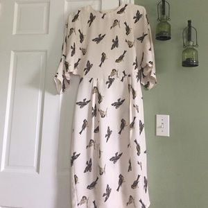 Knee length dress with bird design