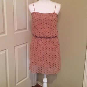 Pink and black polkadot spaghetti strap dress.