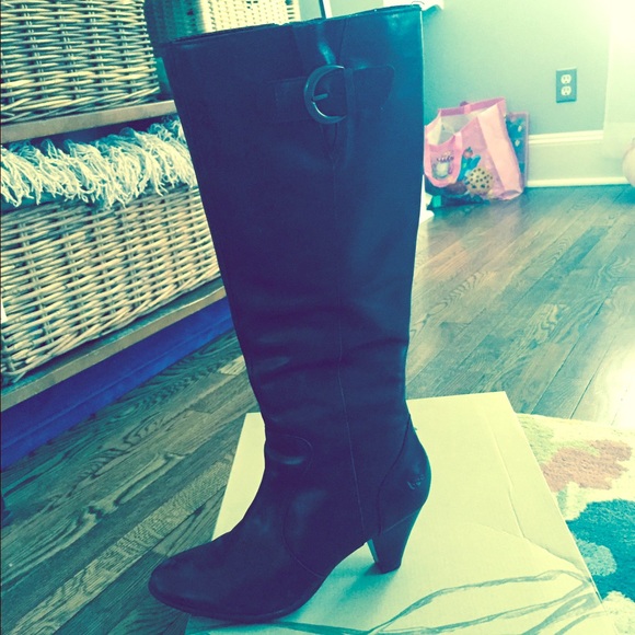 Knee high black boots.