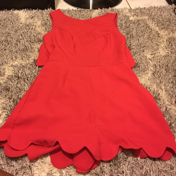 Open back red romper with scalloped hem