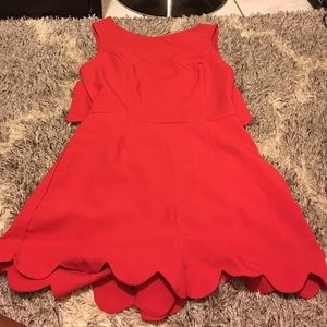 Open back red romper with scalloped hem