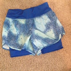 Blue athletic shorts with built in spandex
