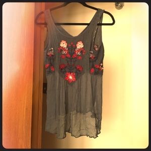 Free People embroidered tank with sheer bottom.