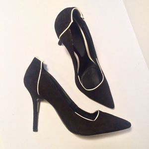 Black pumps with white accent trim
