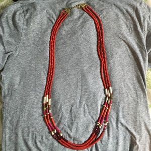 Distressed, multi strand necklace.