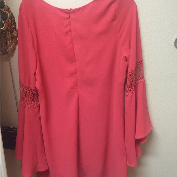 Dress with flared sleeves