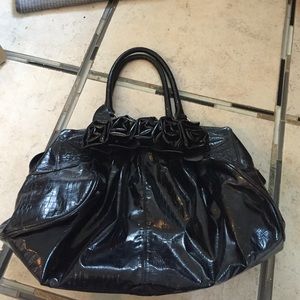 Black purse with rose accents