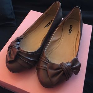 Brown flats with a bow