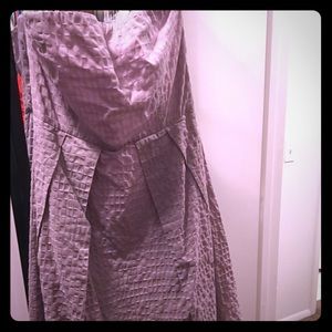 Strapless tea length dress.