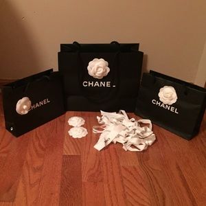 Chanel bags with ribbons and camellias