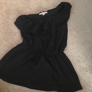 One shoulder black blouse. Cinch waist.
