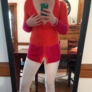 Hot pink and orange cardigan from anthropologie.