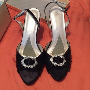 Black dress heals with silver buckle