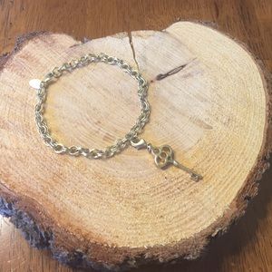 lia sophia gold charm bracelet with key charm