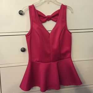 Pink peplum top with bow