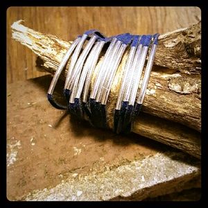 Banded metal and leather strap bracelet