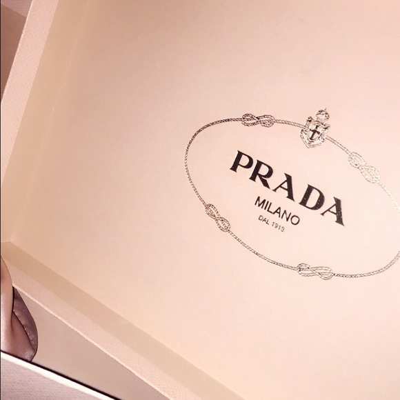 Prada Shoe box + care bag