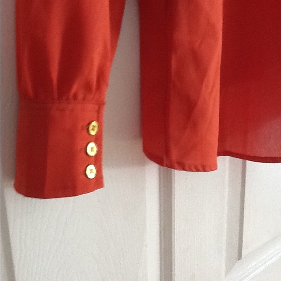 Orange blouse with buttons and should slits