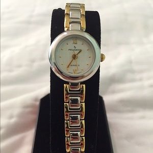 Silver and gold Peugeot watch