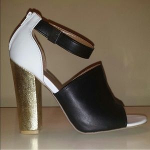 Black, white and gold heels. Black, white and gold heels.
