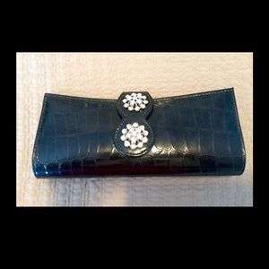 Black clutch with brooch