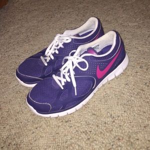 Purple nike athletic shoes