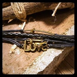 Braided leather bracelet with brass charms