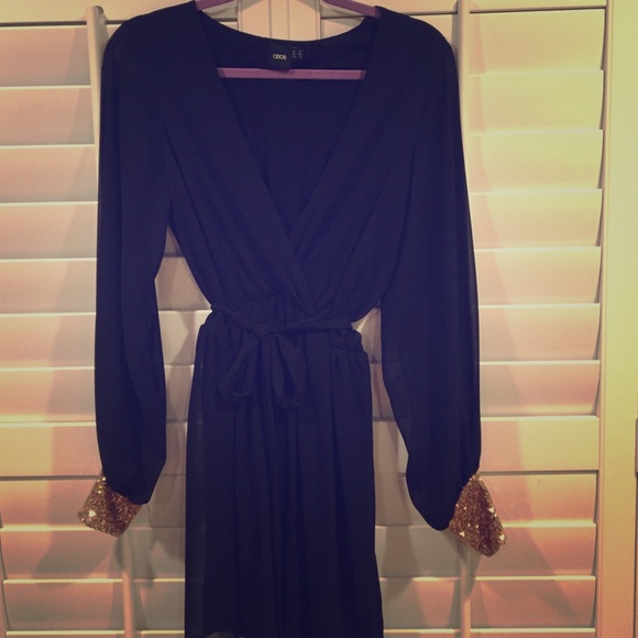 Chic LBD with sequin-cuffed sheer sleeves! Unique!