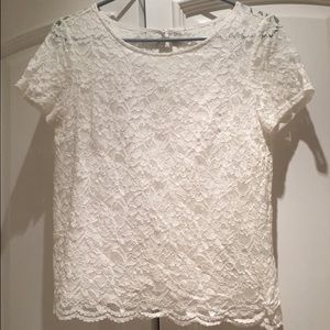 White shirt with a mid opening in the back