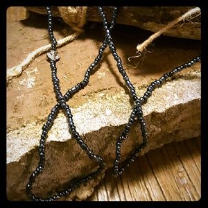 Long black glass beaded necklace with bee