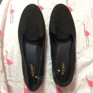 Black loafer flats.