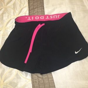 Nike shorts has tight shorts attached underneath.