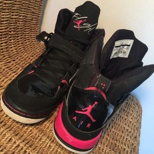 Pink and black Jordan sneakers