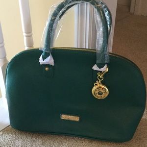 Joy Iman purse, green in color