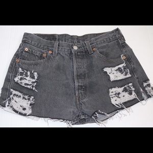 Black Levi's cut-off shorts