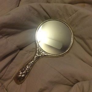 Hand held mirror