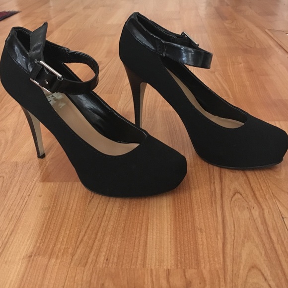 Black suede heels with leather buckle straps