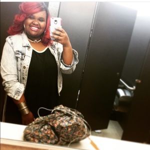 This is a Forever 21 faded denim jacket.