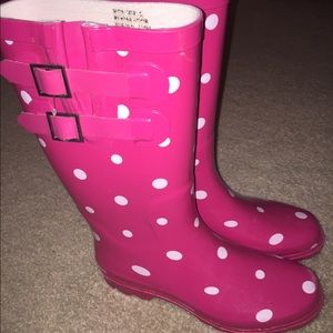 Pink and white polka dotted rain boots