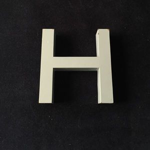Blue turquoise "H" sign