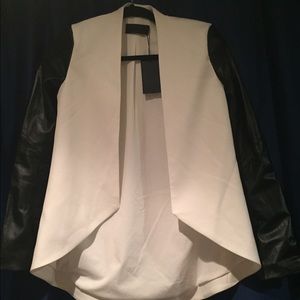 White blazer with black sleeves