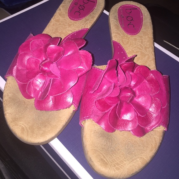 Hot pink slip on sandal with flower detail.