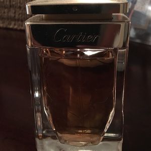 2.5 fluid ounces of Cartier perfume