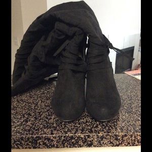 Strappy black heeled boots