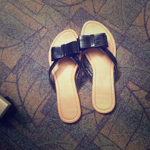 Bow tie black slip on sandals.