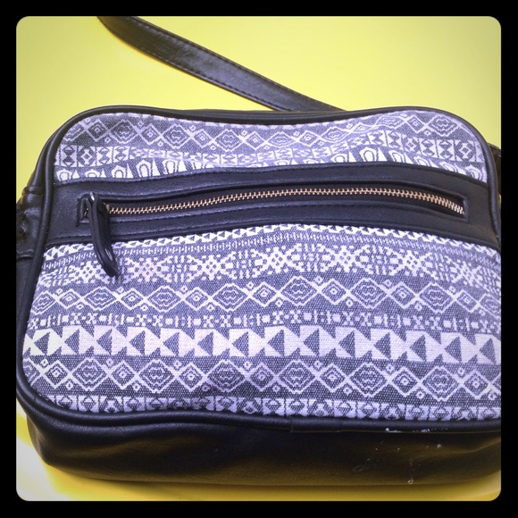 Black retro over the shoulder mini purse.